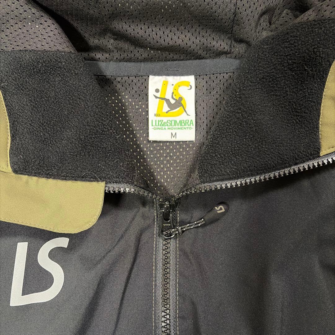 LUZ e SOMBRA ピステ・ウィンドブレーカー M カーキ