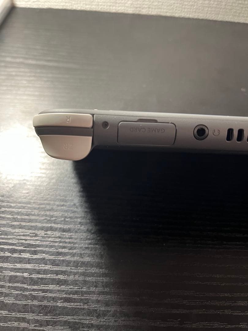 グレーの Nintendo Switch Lite、充電器 付き 大和桜