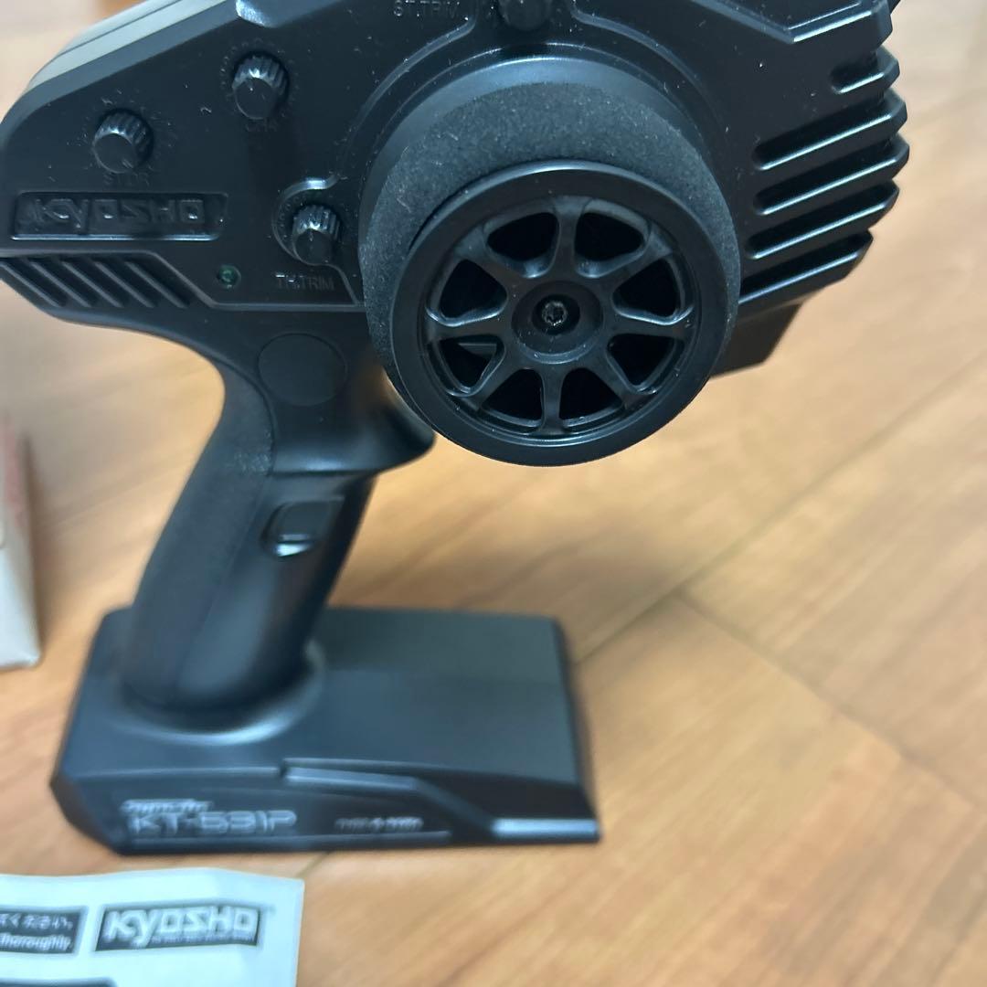 タカクワツトム