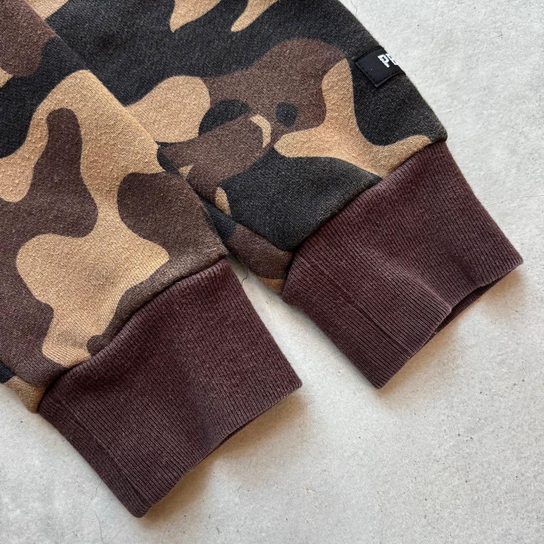 PEARLY GATES 迷彩カモフラ総柄 ジップフードパーカー にこちゃん刺繍