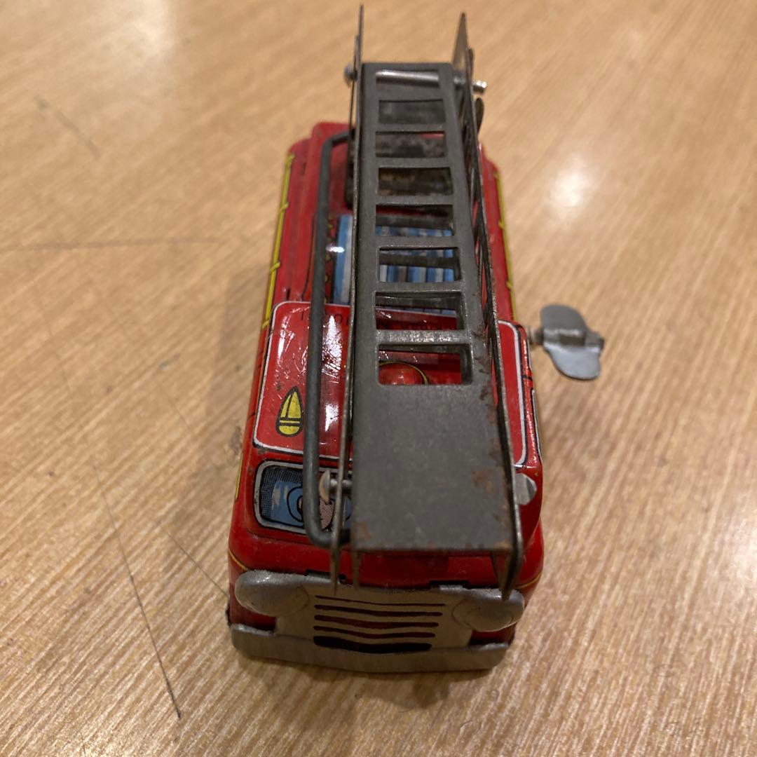 消防車 ミニカー 可動式はしご付き米澤製のゼンマイブリキ素材