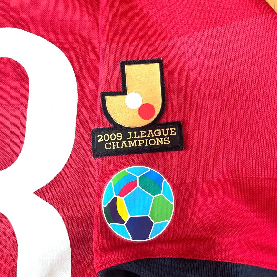 鹿島アントラーズ　2010ユニフォーム　マルキーニョス選手　Ｍサイズ　金色Ｊ