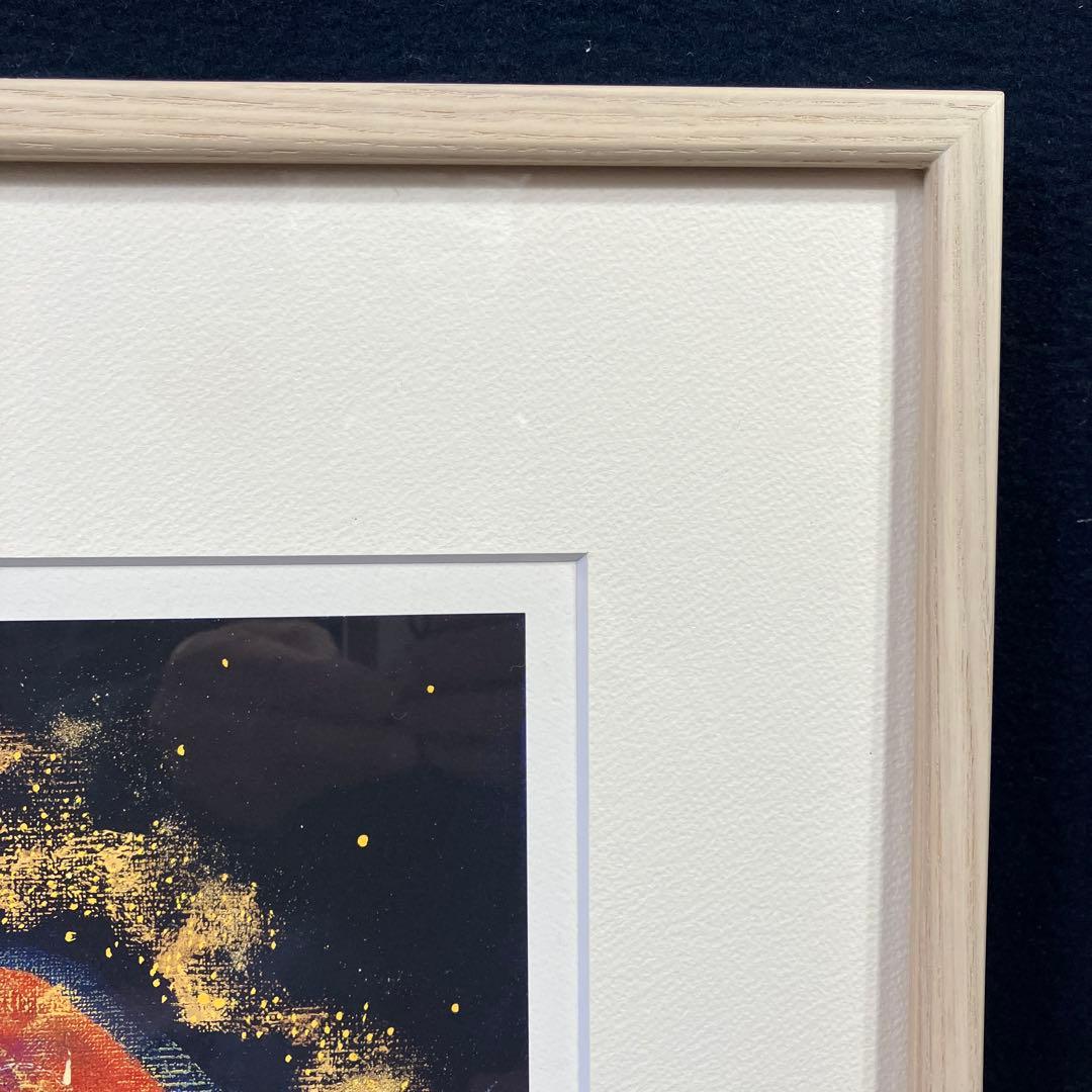 版画　前田麻里「オカリナを吹く少年」