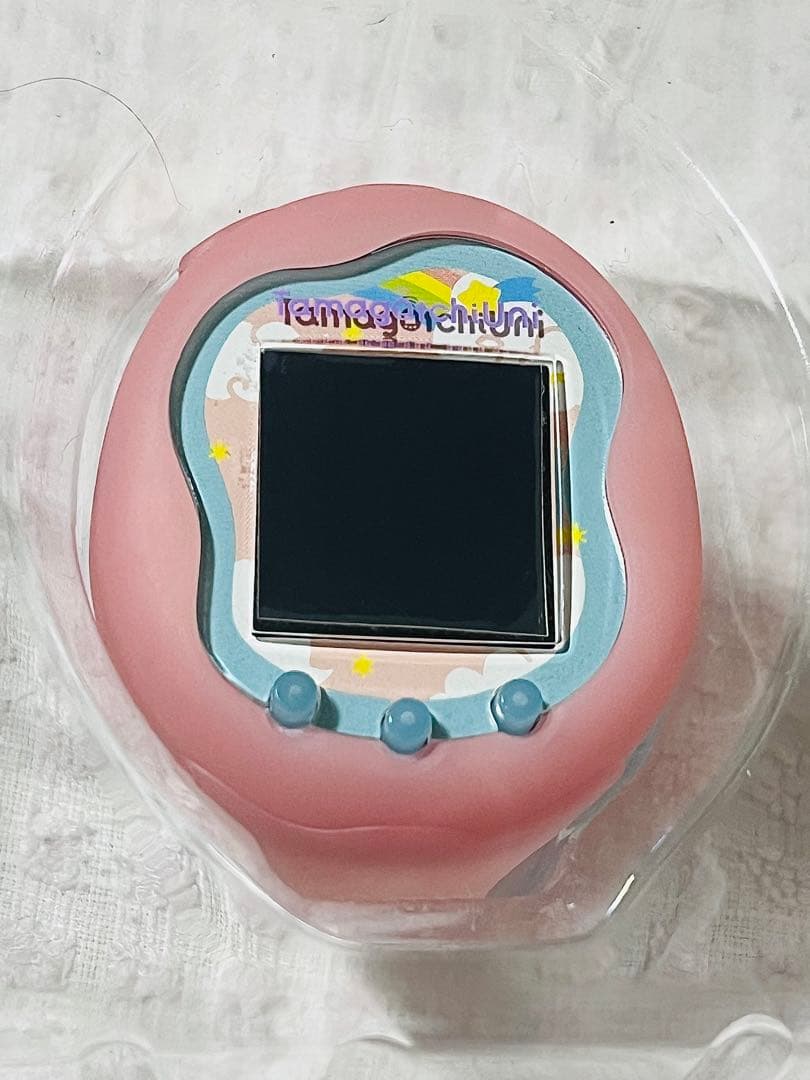 Tamagotchi Uni 本体とケースとガイド