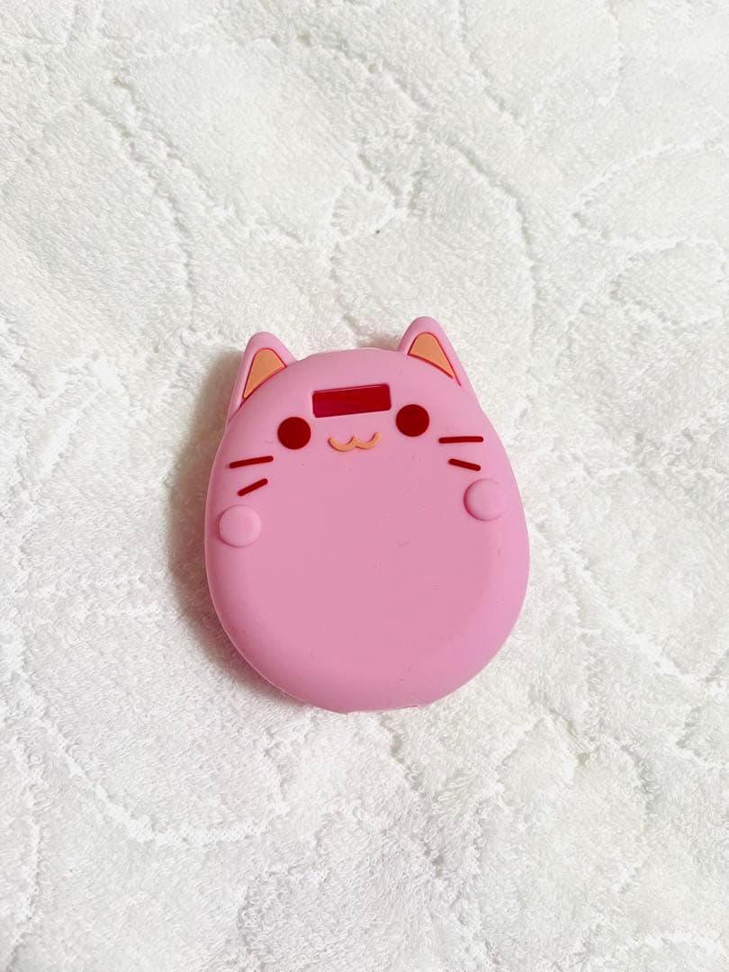 Tamagotchi Uni 本体とケースとガイド